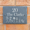Stick figures slate house sign