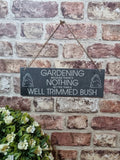 Well trimmed bush garden slate sign