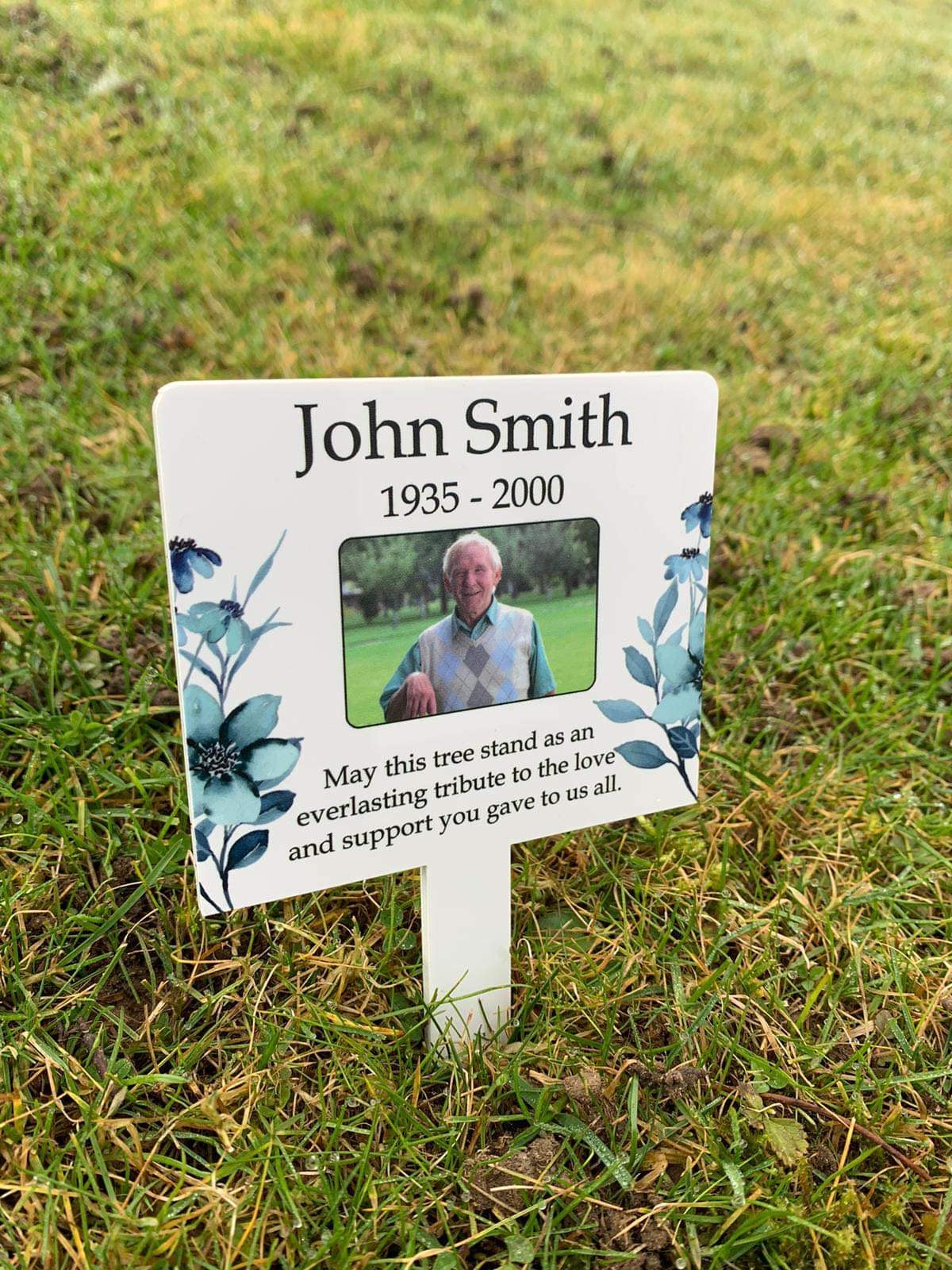 White floral memorial stake